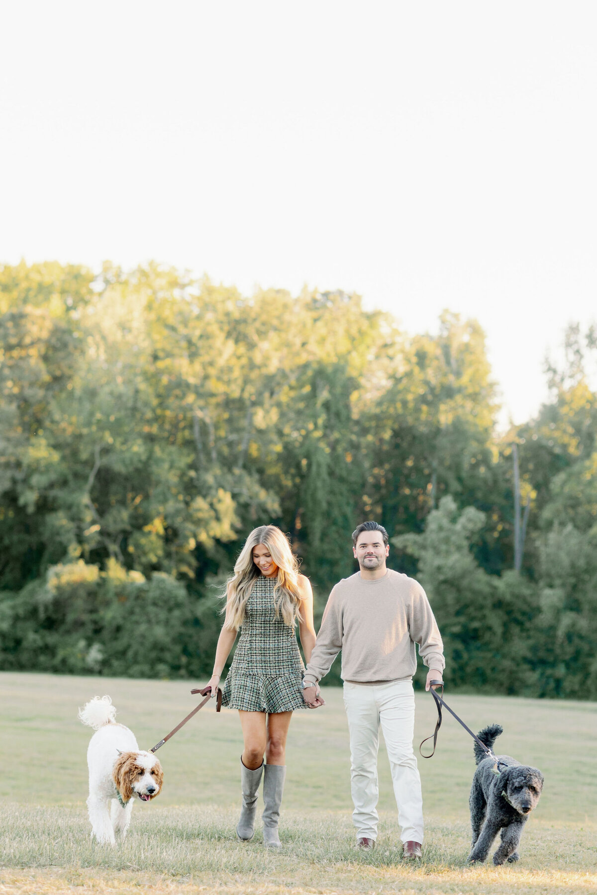 Couple walking their dog in the park