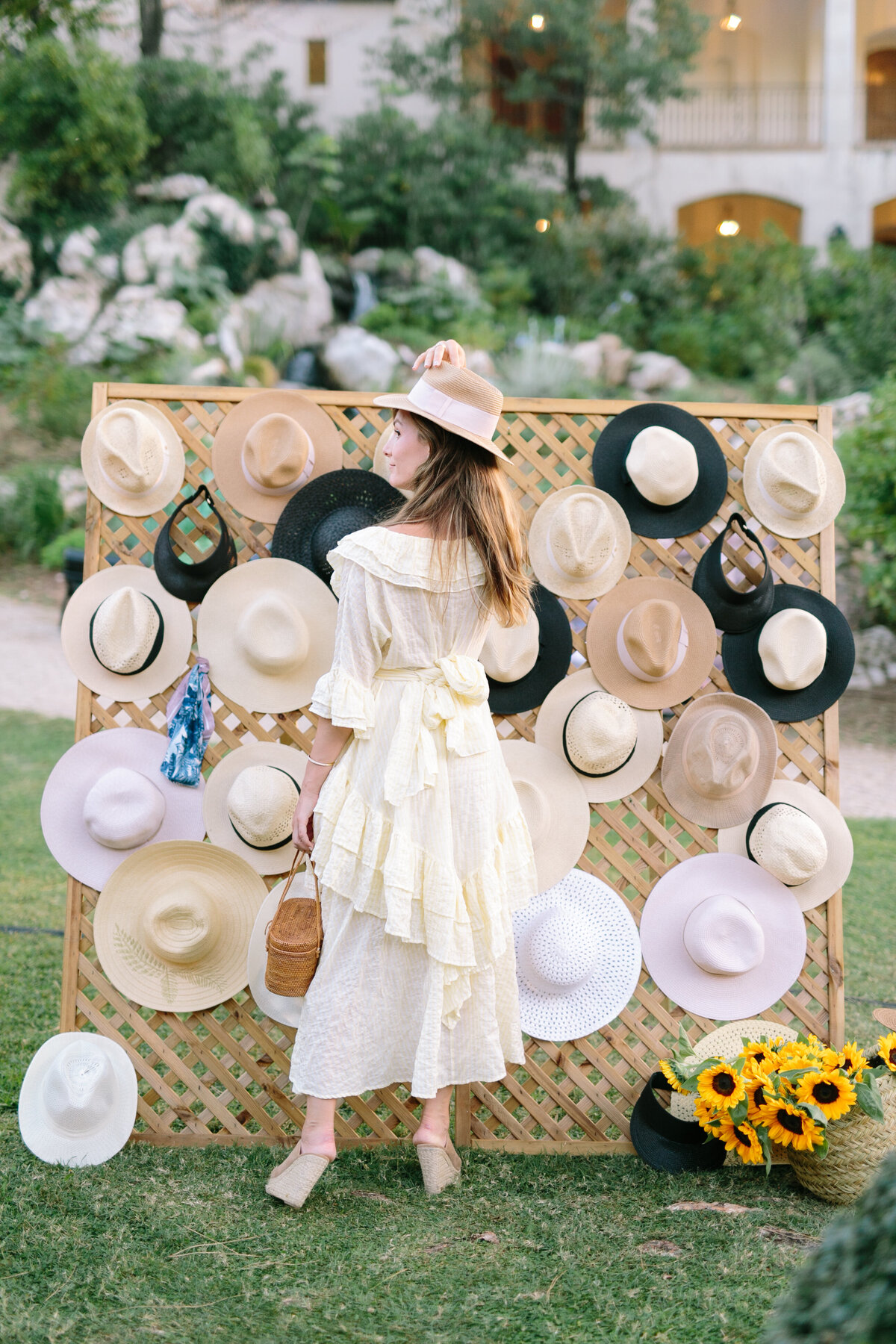 Boho chic decor with a straw hat wall