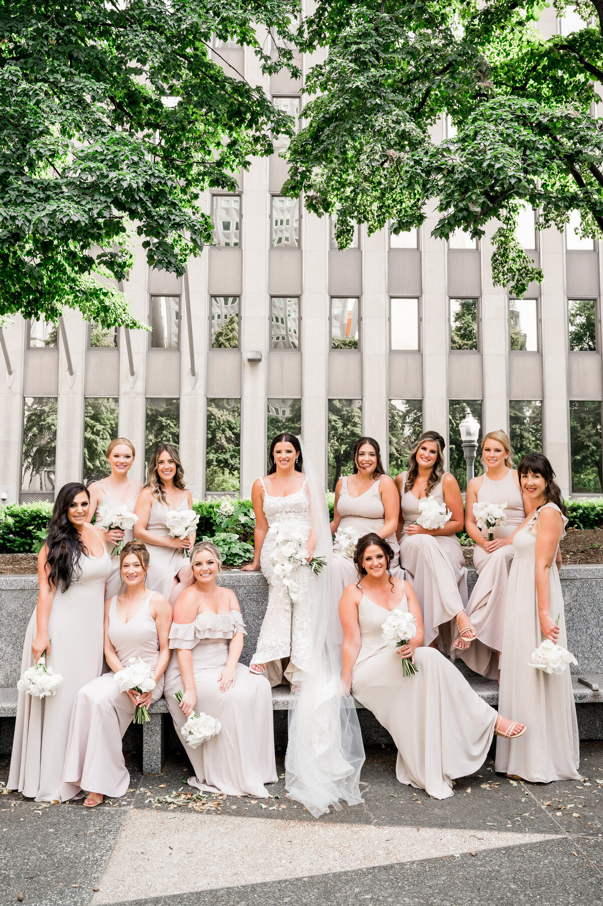 bridesmaids posing for photos outside of the omni