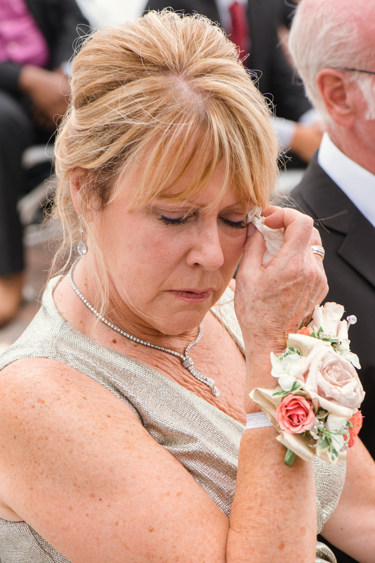 photo of mom crying during wedding ceremony at Lombardi's on the Bay