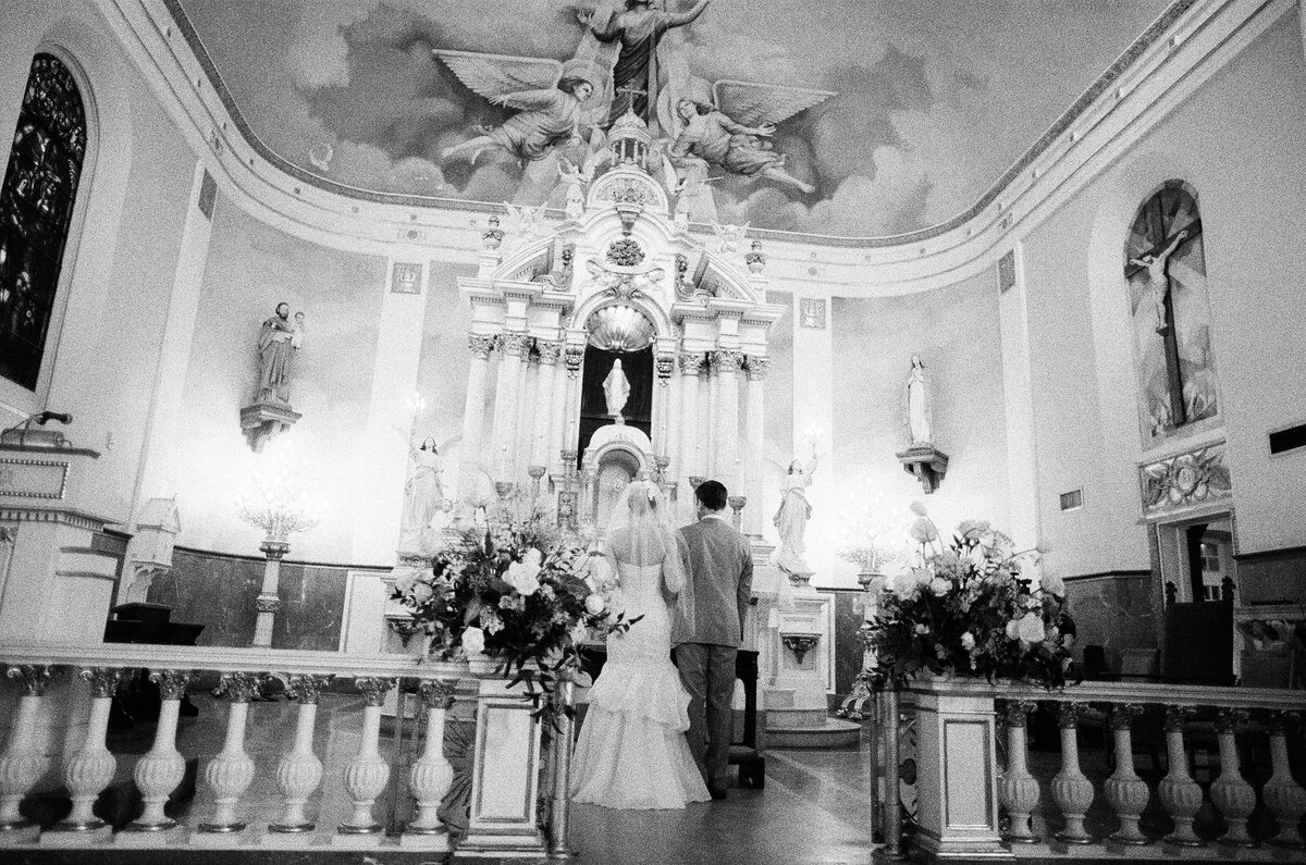 Bride and groom at the alter of a historic church in New Orleans