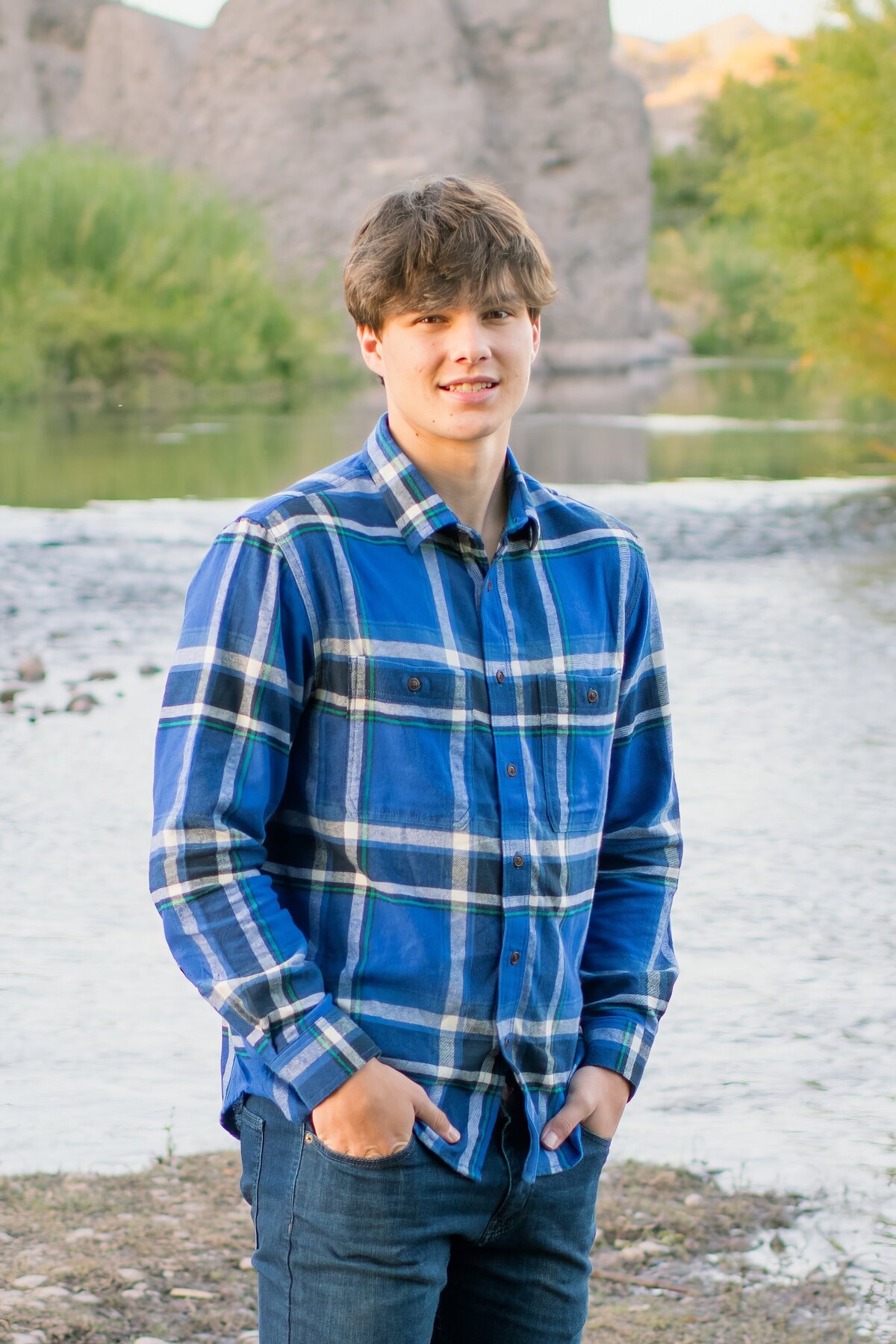 senior boy posing for senior photos in the rio verde river valley