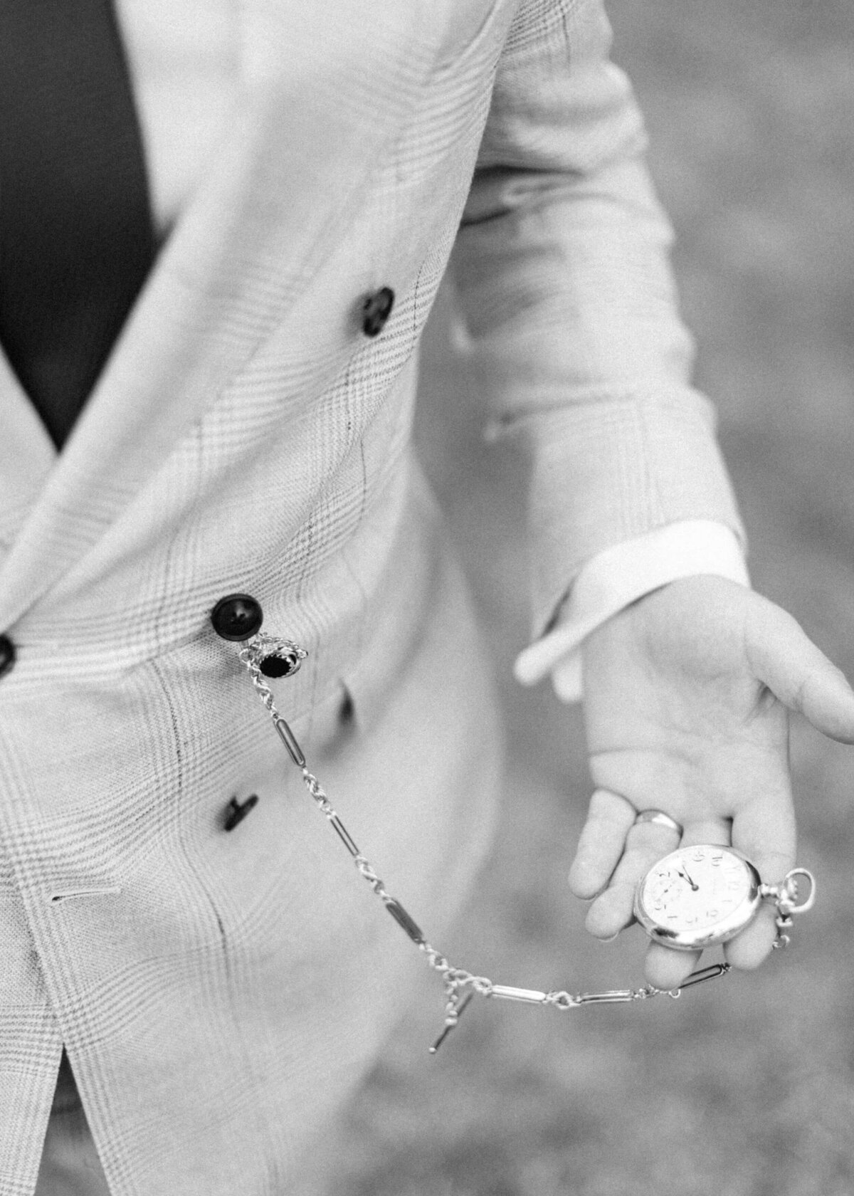 chloe-winstanley-weddings-grittleton-house-groom-grey-suit-pocket-watch