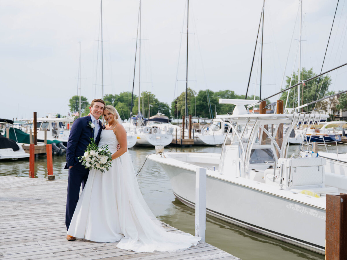 Bride and groom by the water at Cleveland Yachting Club