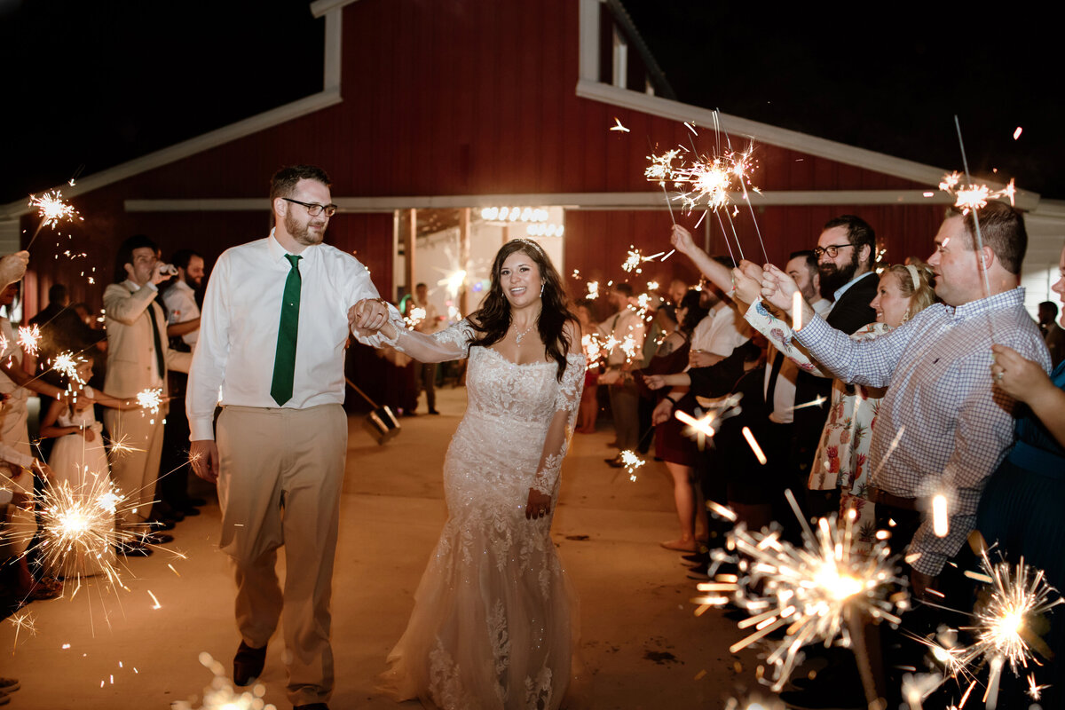 A sparkler wedding exit at Pecan Creek Farm in Venus Texas. Captured by Fort Worth Wedding Photographer, Megan Christine Studio