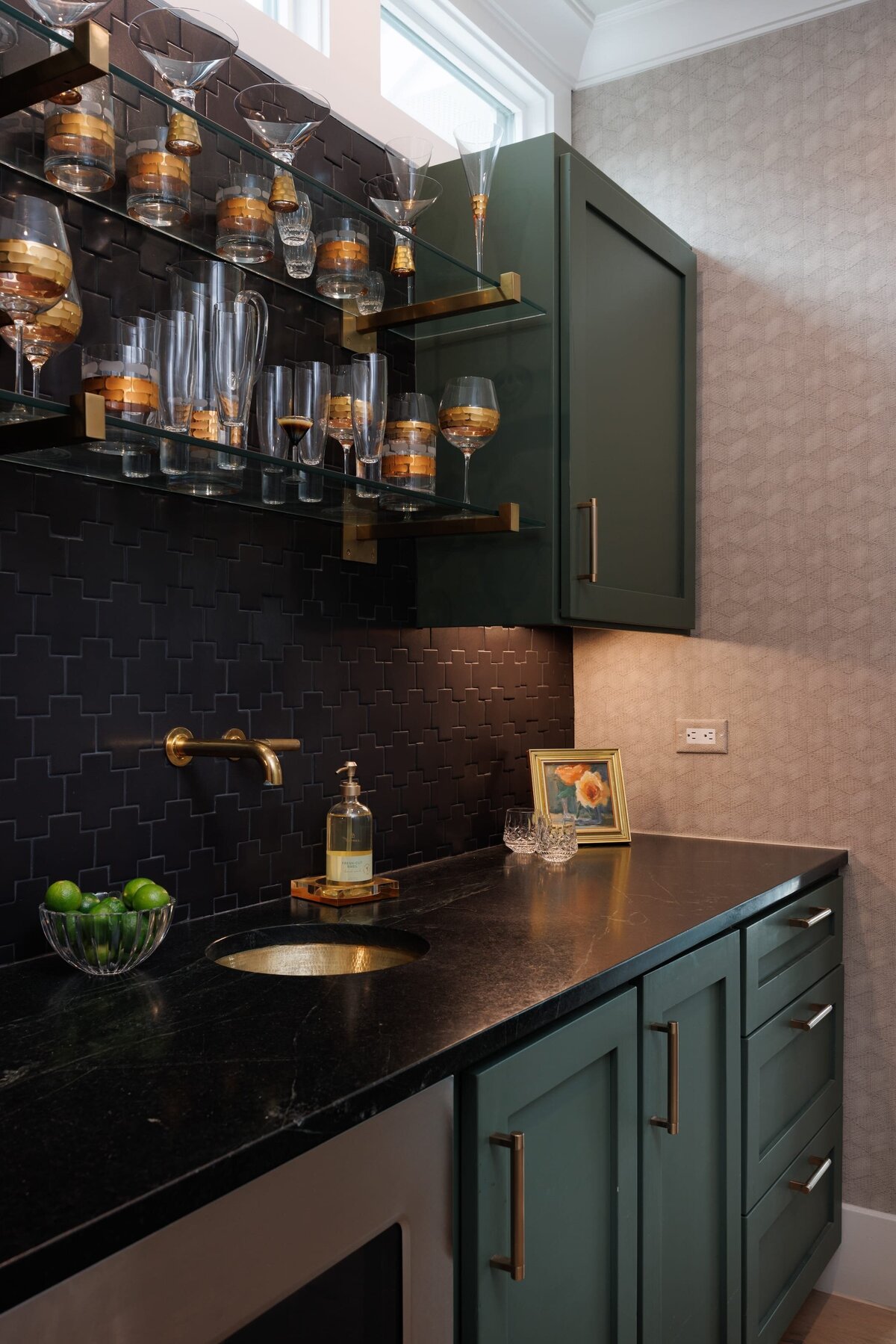the keeping room interiors primera bar area with green cabinets and dark counter