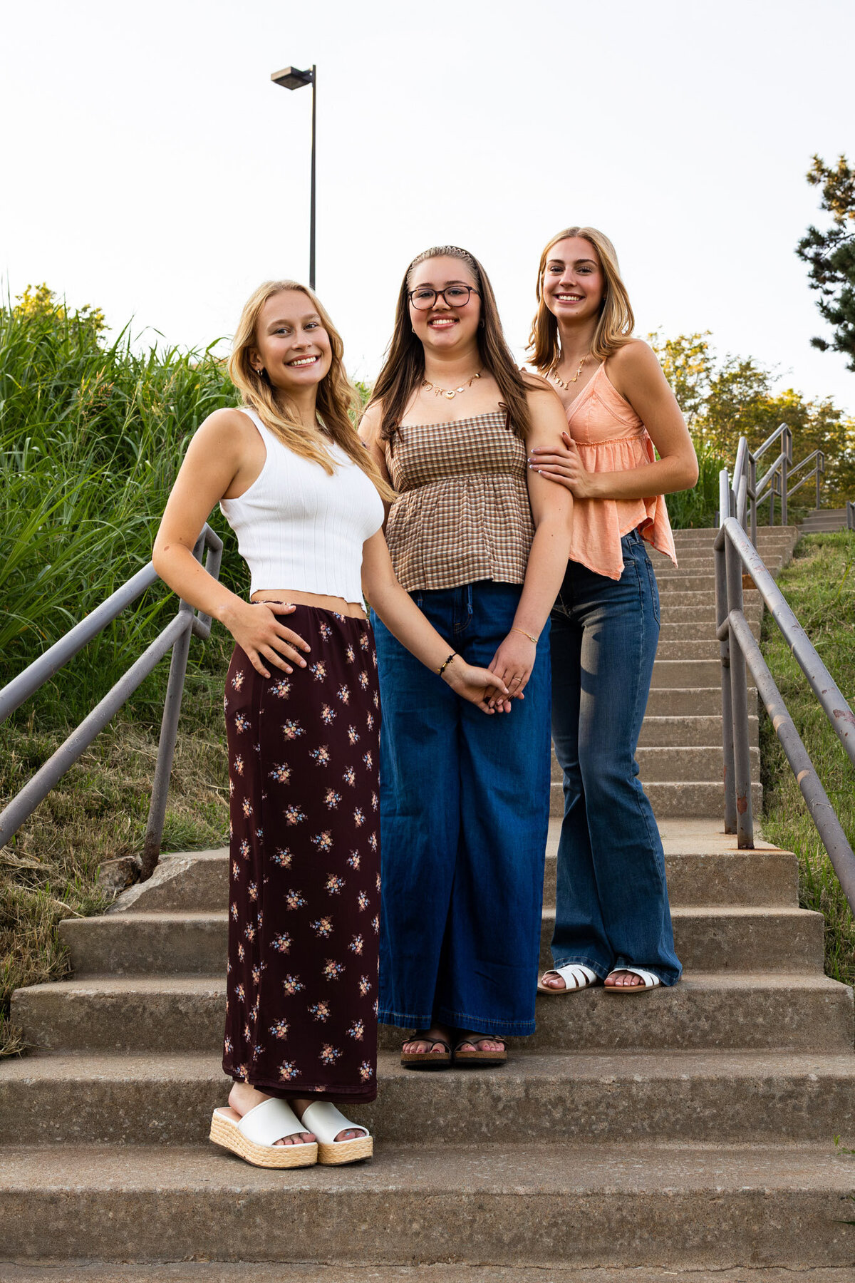MBP Senior team standing on stairs staggered in Lawrence, KS
