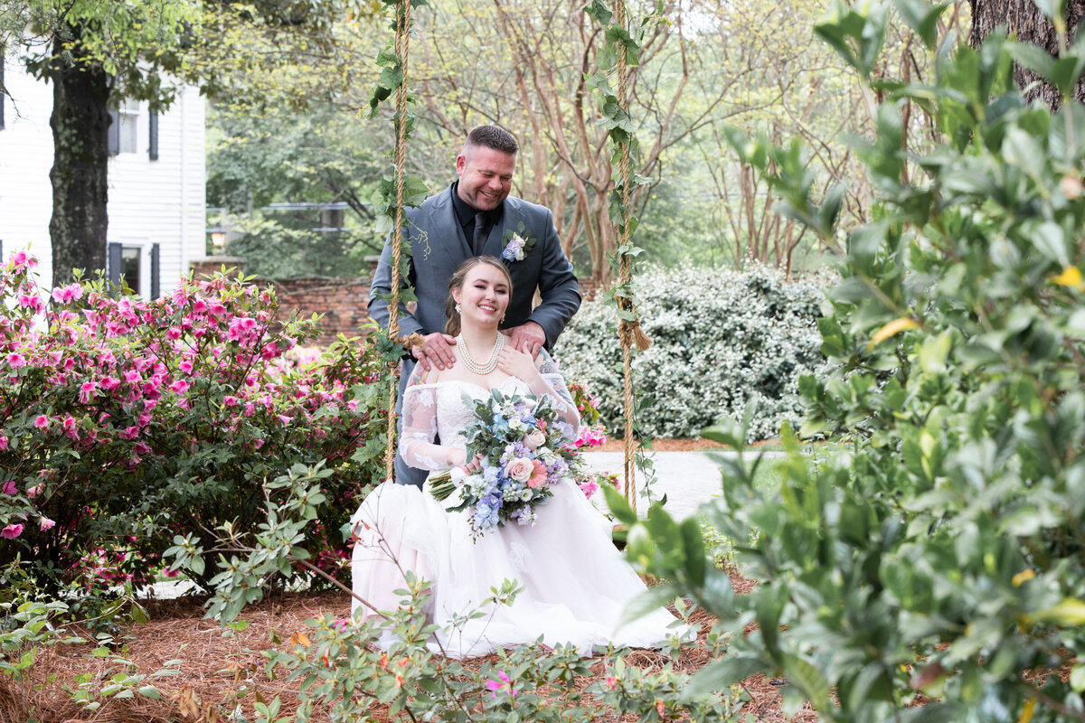 Carl-House-Auburn-GA-Bride-Groom-On-Swing-Garden-Wedding-Portrait