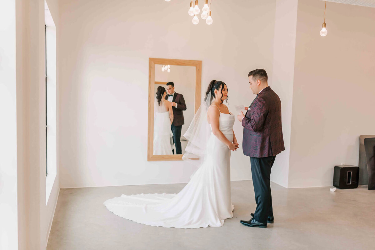 Bride and groom say their vows  with just each other. 