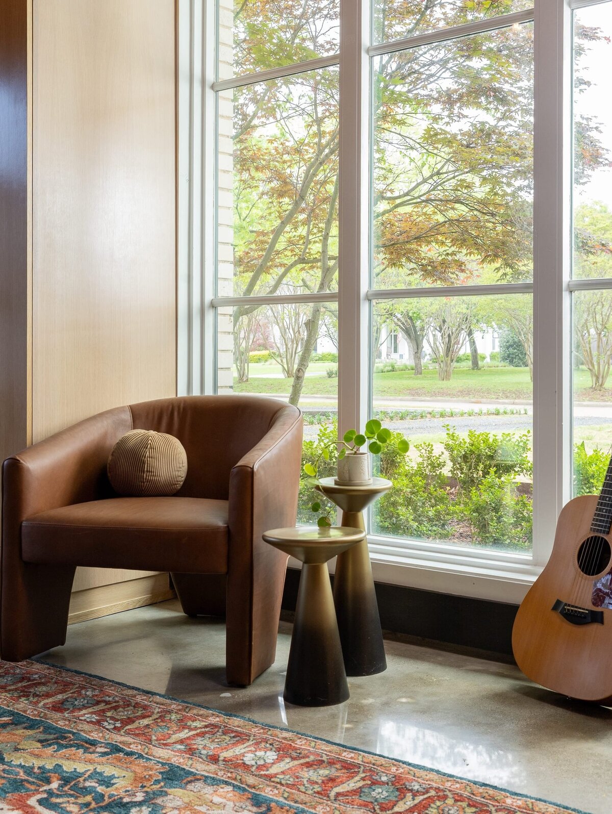 rebekah nicole interiors arbor garage room with large window and leather chair