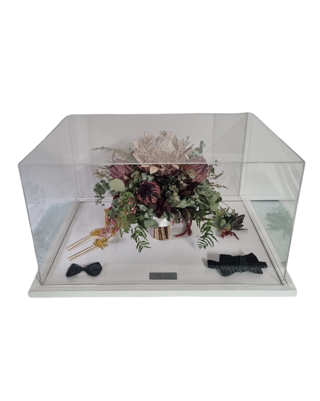 Wedding bouquet preserved inside perspex keepsake.