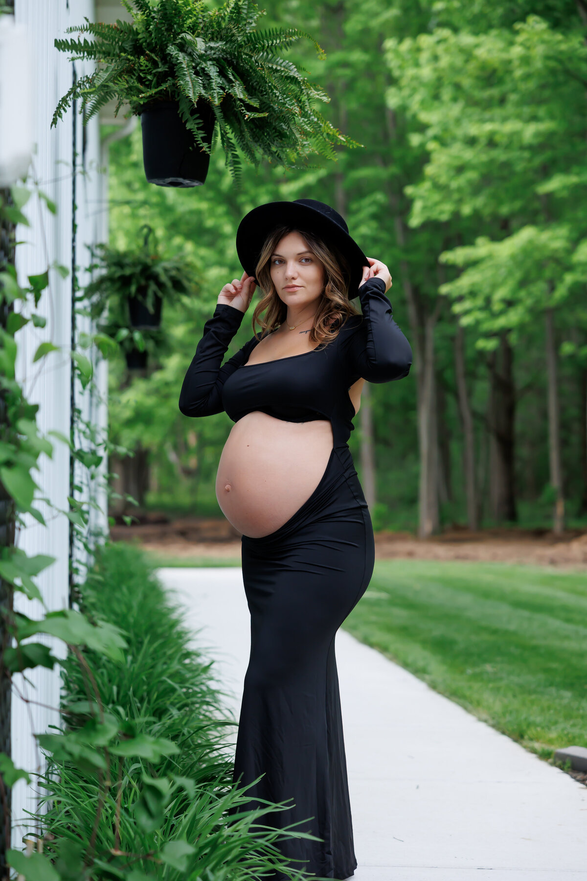 A beautiful photo of a pregnant woman showing off her baby bump Photo taken In Clio, MI 