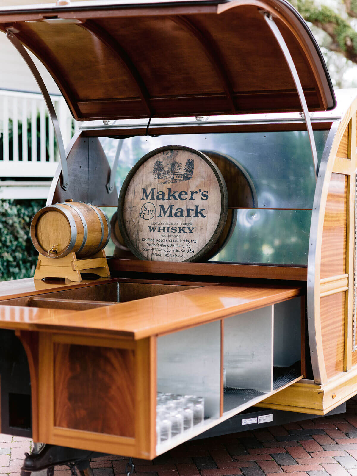 A cute, mini wooden mobile bar in Montage at Palmetto Bluff. Destination wedding image by Jenny Fu Studio