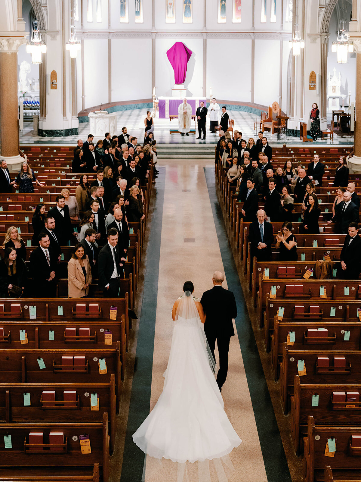 Bride and Father walk down the aisle during ceremony