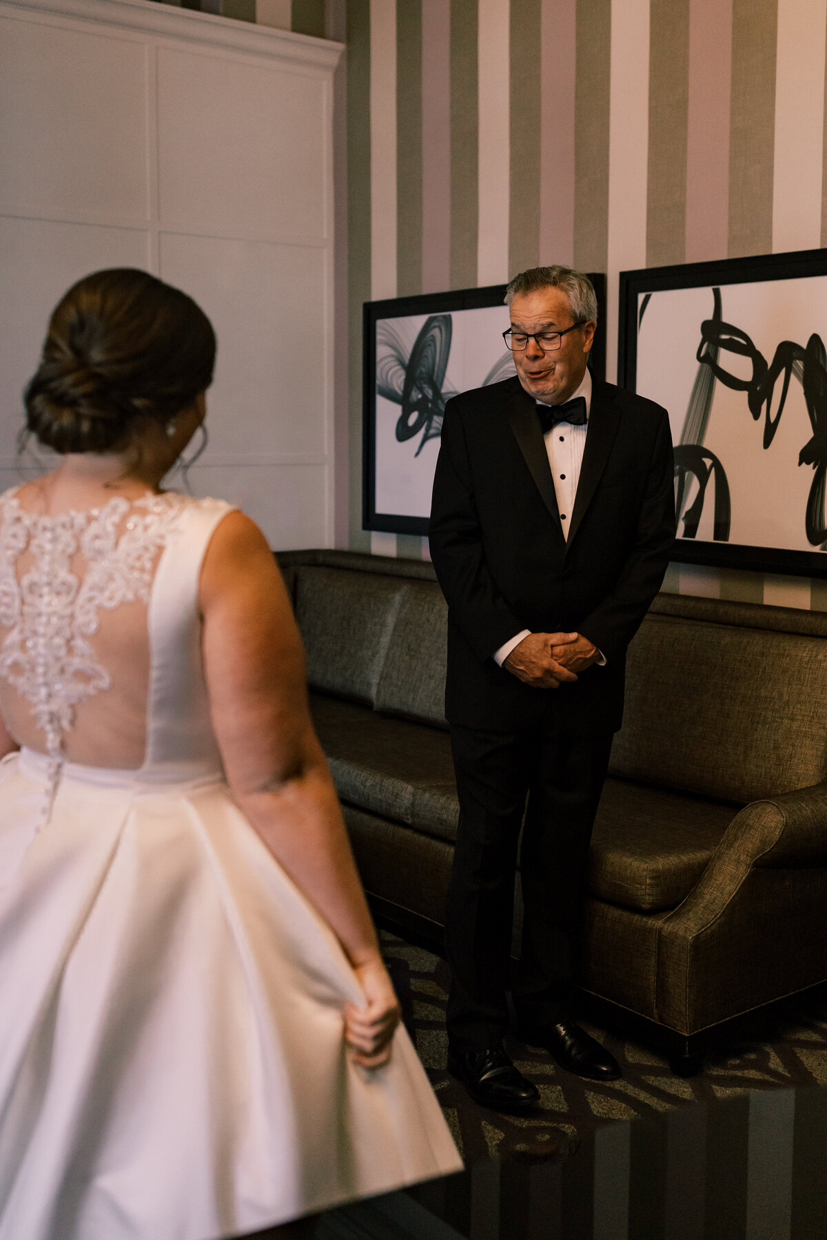 Emotional father seeing his daughter in her wedding gown during first look at Hotel Monaco Washington DC.