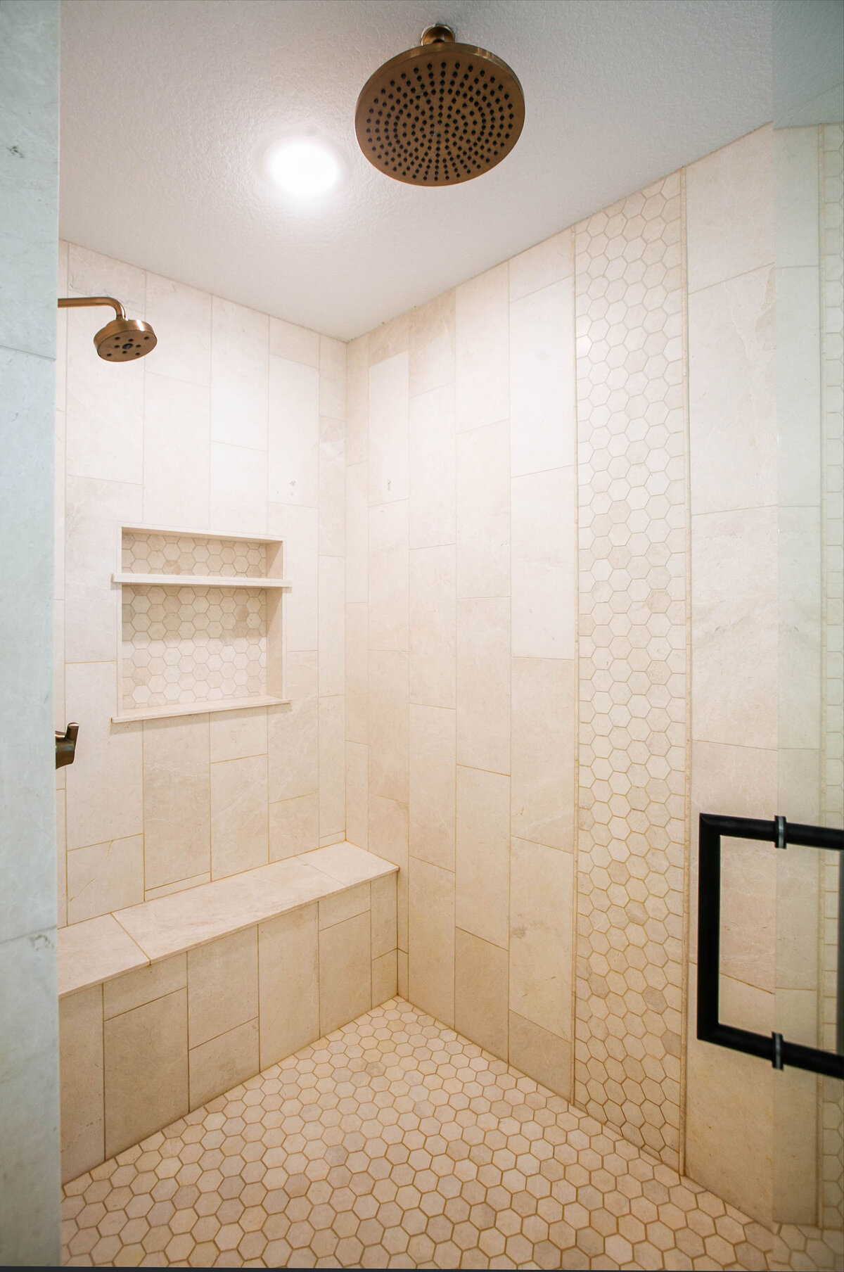 Custom bathroom with soaking tub, double vanity, and walk-in shower in Otsego custom home