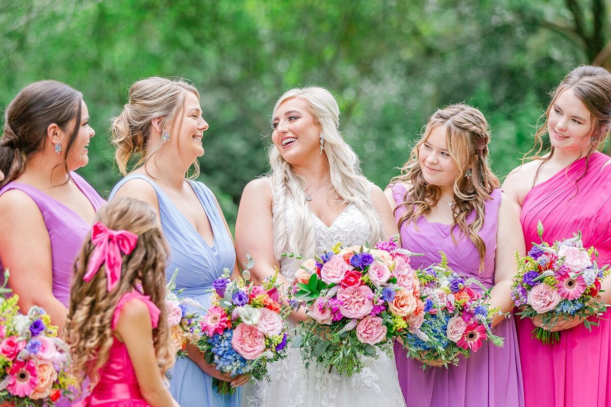 Laughing bride with bridesmaids and colorful florals  | Elms of Coosada Wedding Photographer 