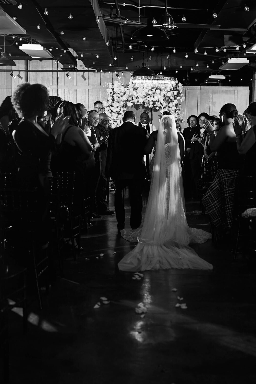 Bride and fathers walk in the aisle