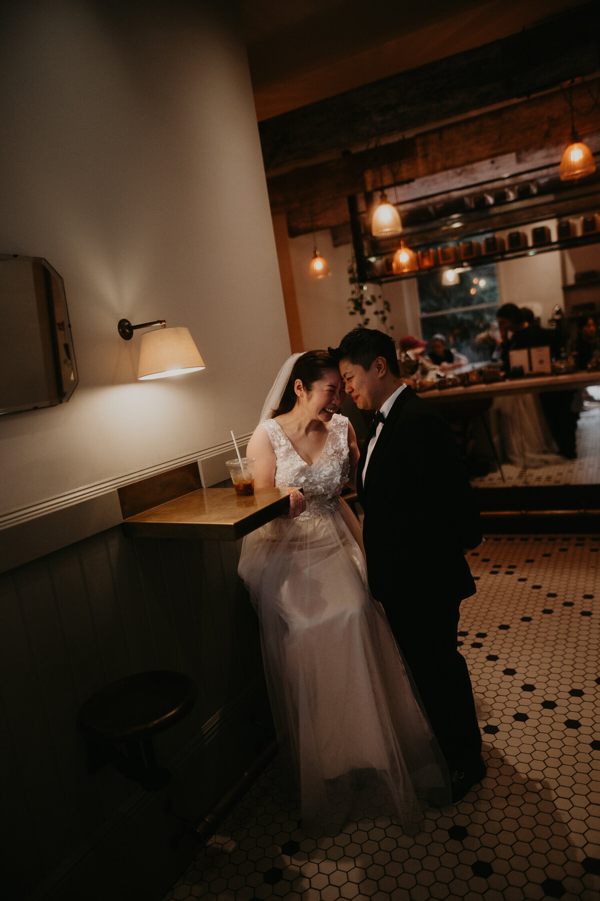 Same sex couples portraits in a coffee shop in Chelsea in London.