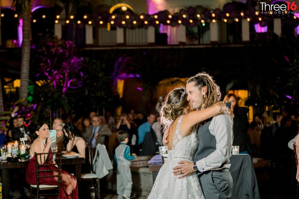 Bride and Groom embrace during their First Dance