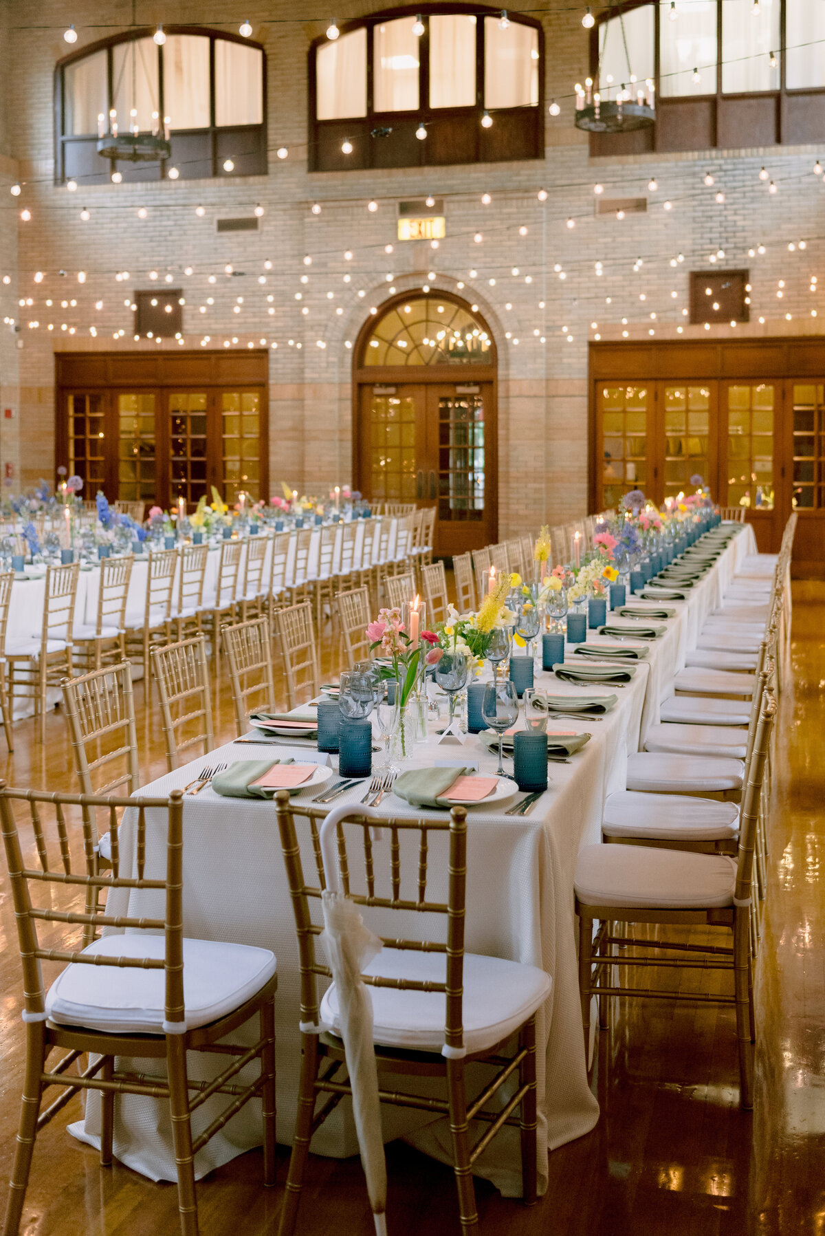 Long tables with colorful flowers and design elements