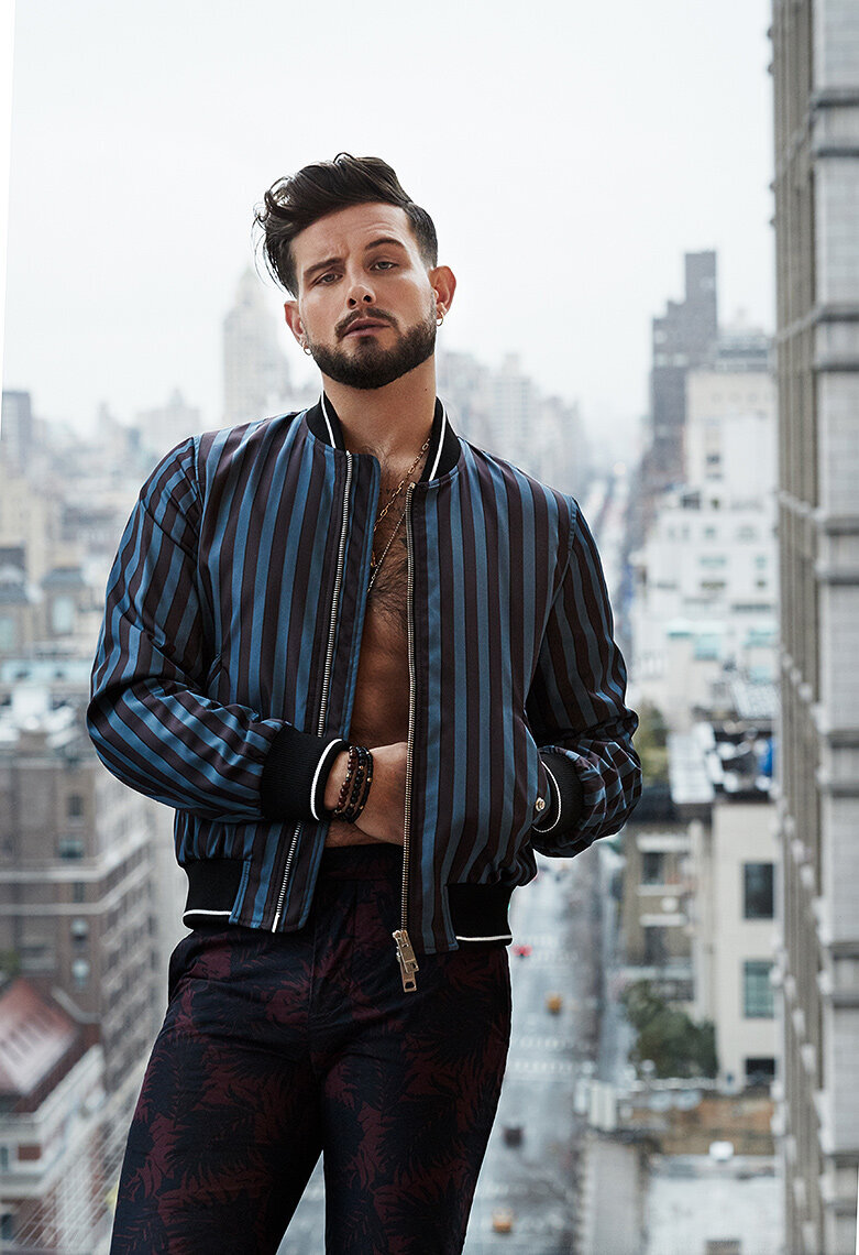 Nico Tortorella in a stylish, urban portrait, highlighting a confident pose and edgy fashion, photographed by Ylva Erevall.