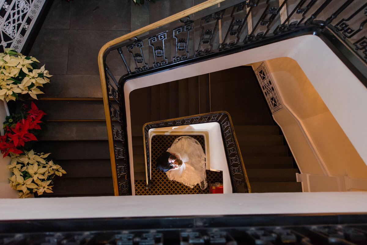 photo of bride and groom from the top of the staircase from wedding at The Carltun