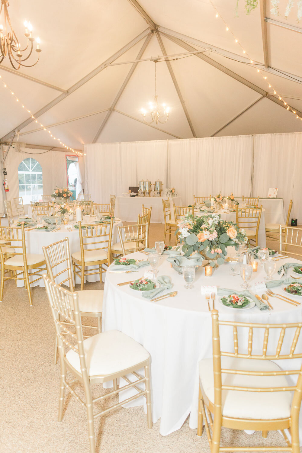 Indoor wedding reception with elegant designed tables and chairs