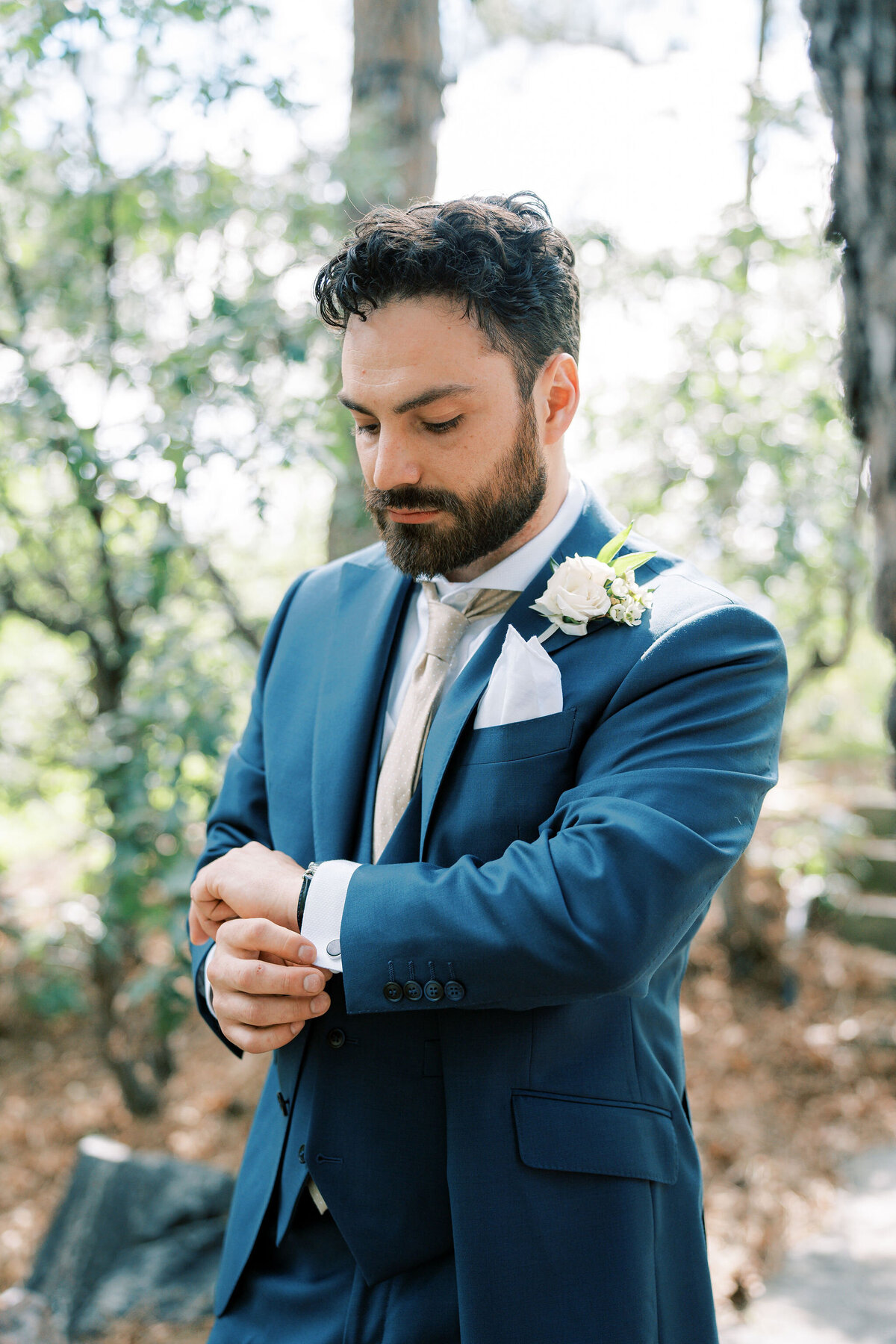 groom adjust cufflinks