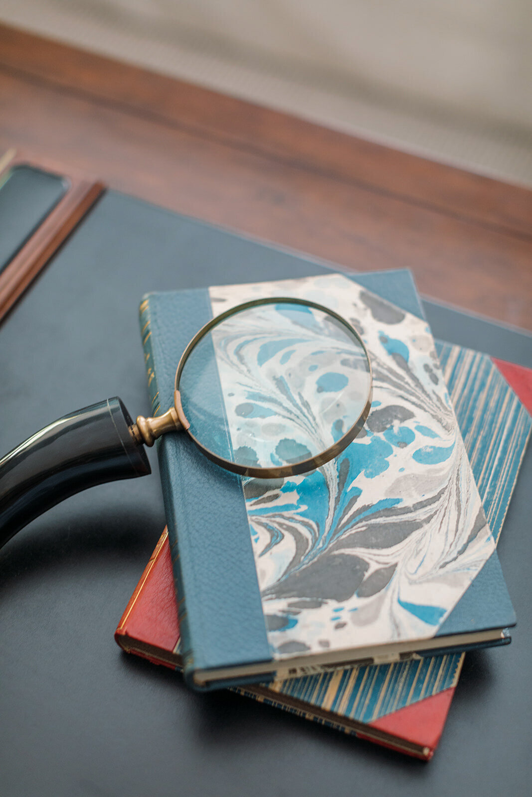Magnifying Glass and Vintage Books