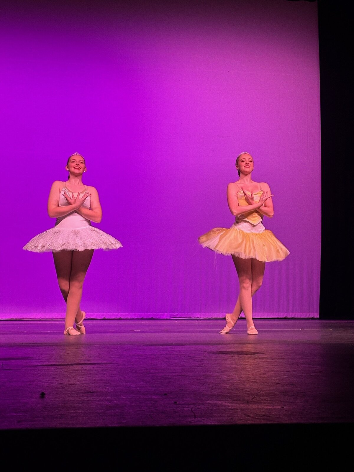 2 seniors doing ballet bows- sun and moon princess
