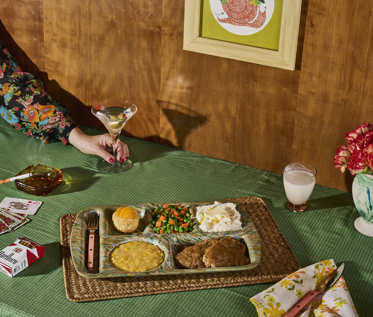 1970s themed photoshoot with martini and tv dinner