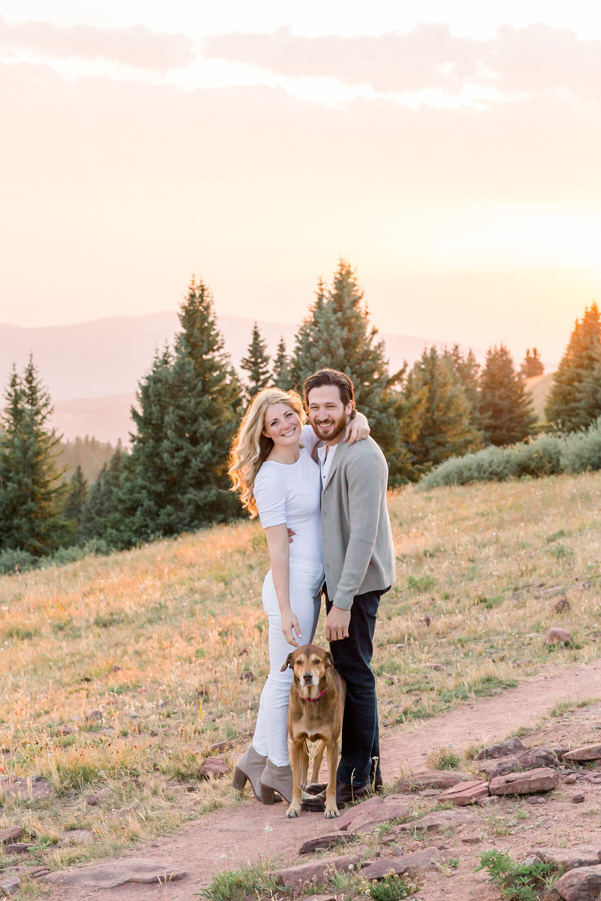 Engaged couple with their dog in Colorado