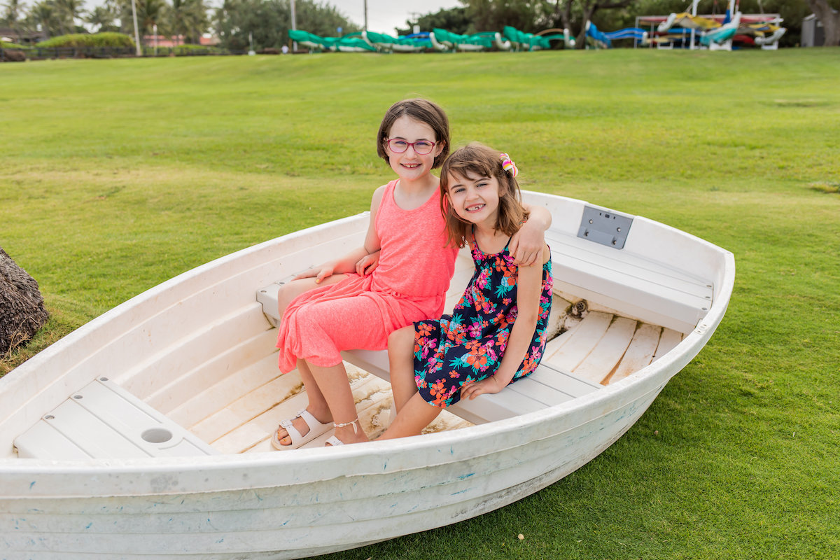 Kauai family portraits with boat
