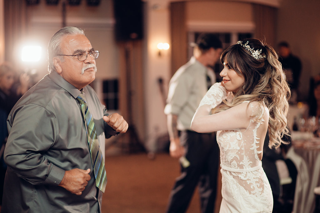 Wedding Photograph Of Man In Gray Suit Dancing With The Bride Los Angeles