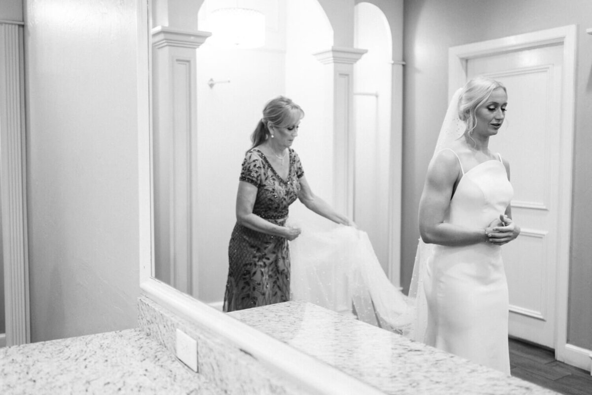mother-of-bride-adjusting-pearl-veil