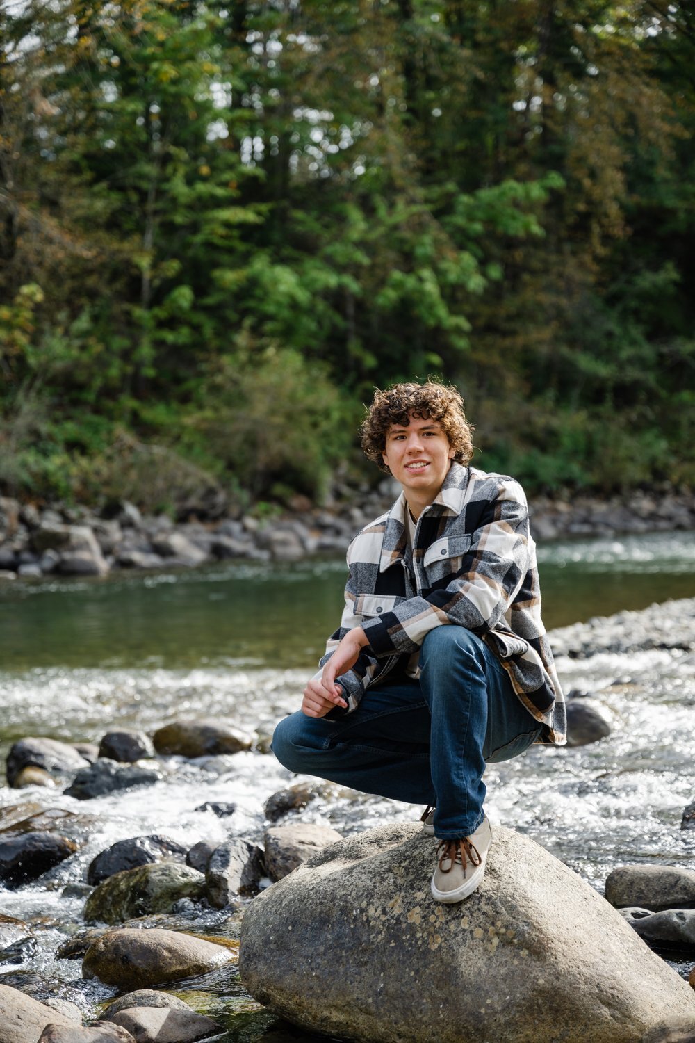 mount si high school senior guy plaid shirt at river