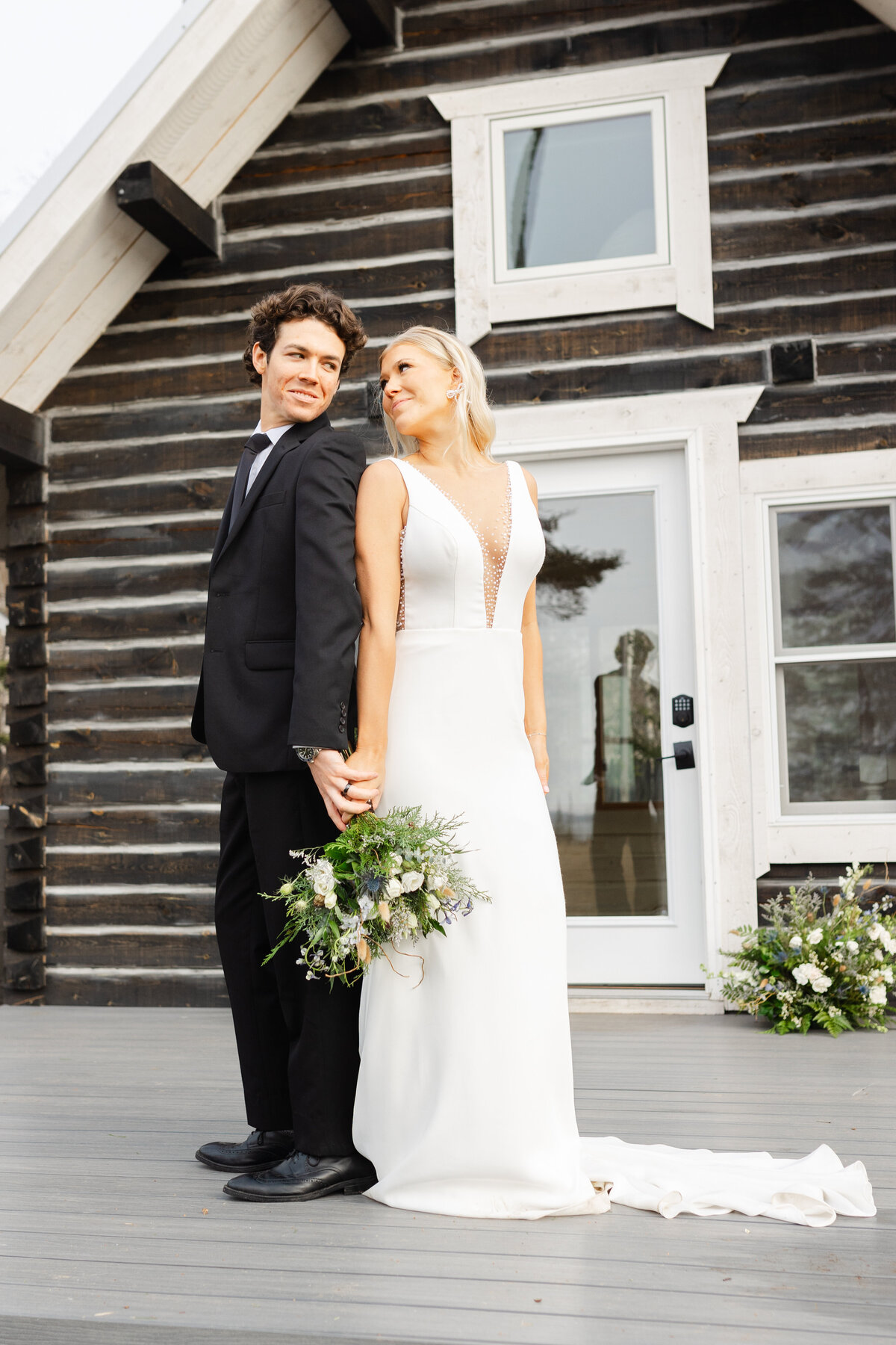 At an A-frame cabin outside on the North Shore, a Duluth wedding photographer captures an outdoor elopement.