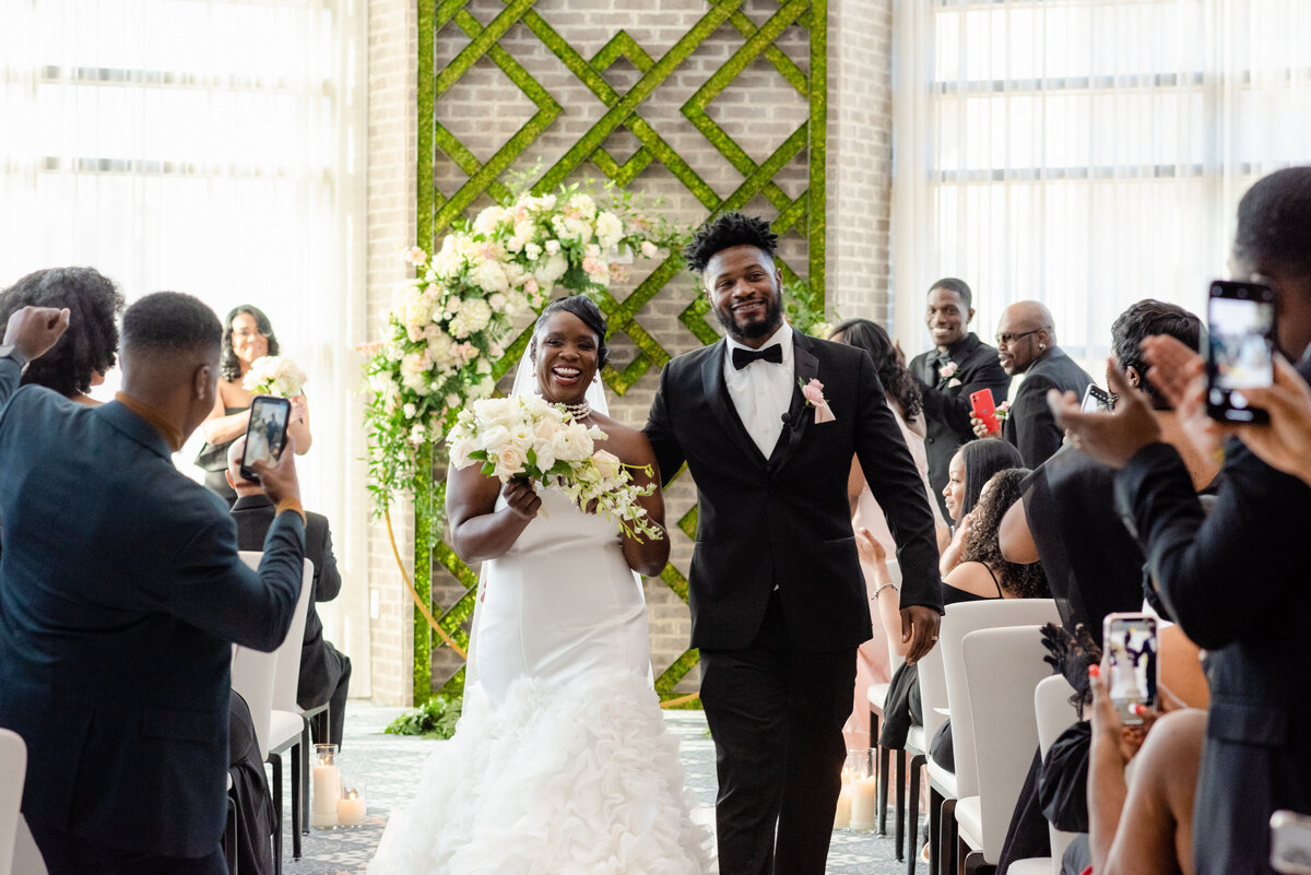 Hotel-at-Avalon-Wedding-happy-walk-down-aisle