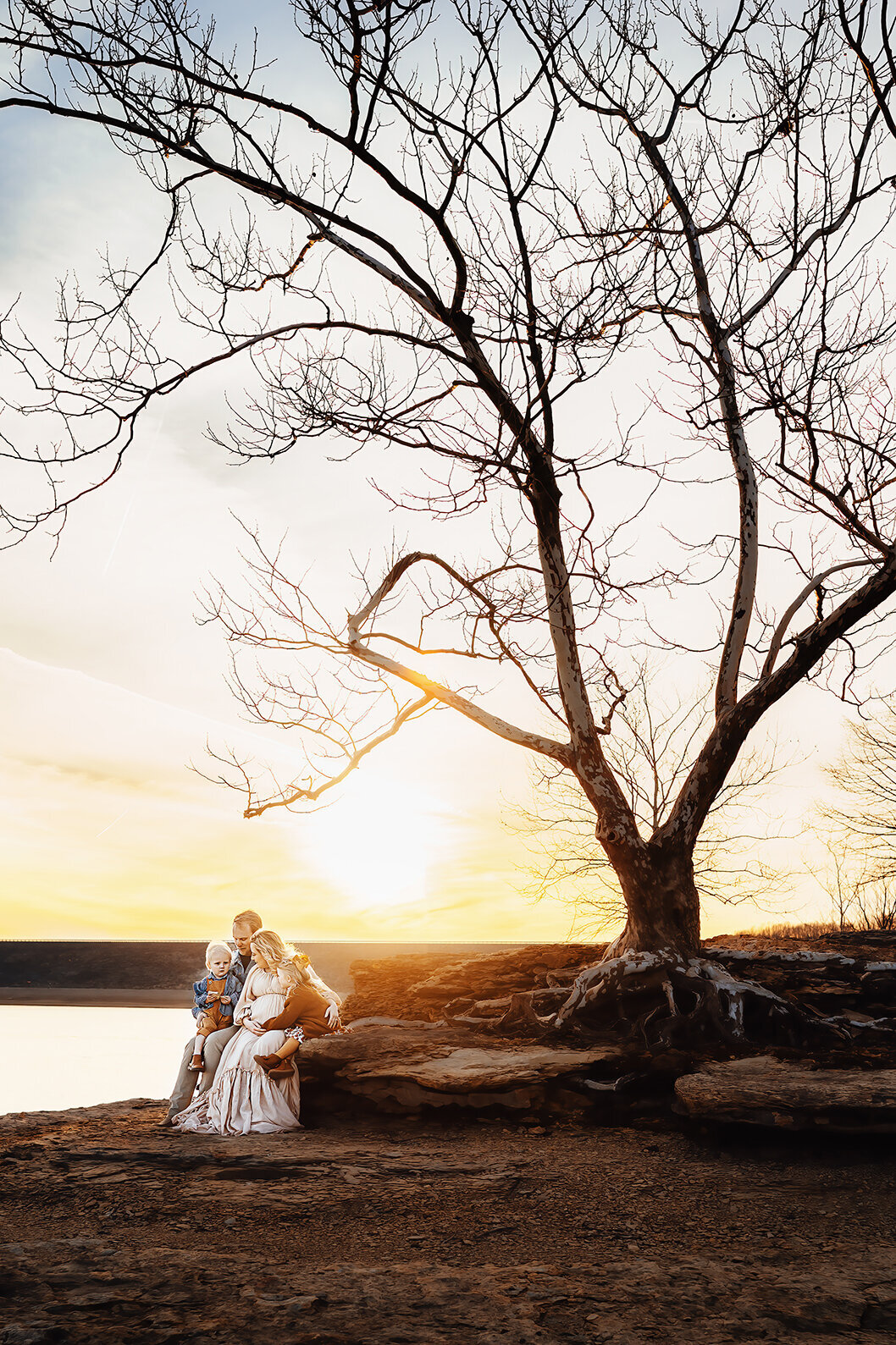 Bowling Green Kentucky family photographer. Family enjoying the sunset on a rock.