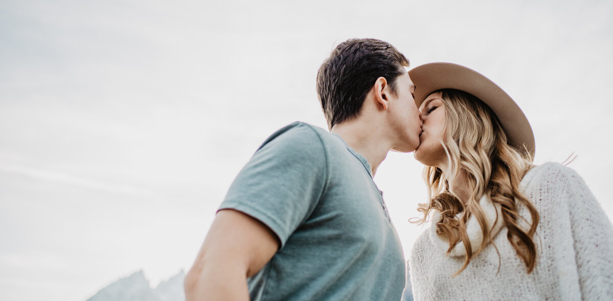 Photographers Jackson Hole capture man and woman kissing during engagements