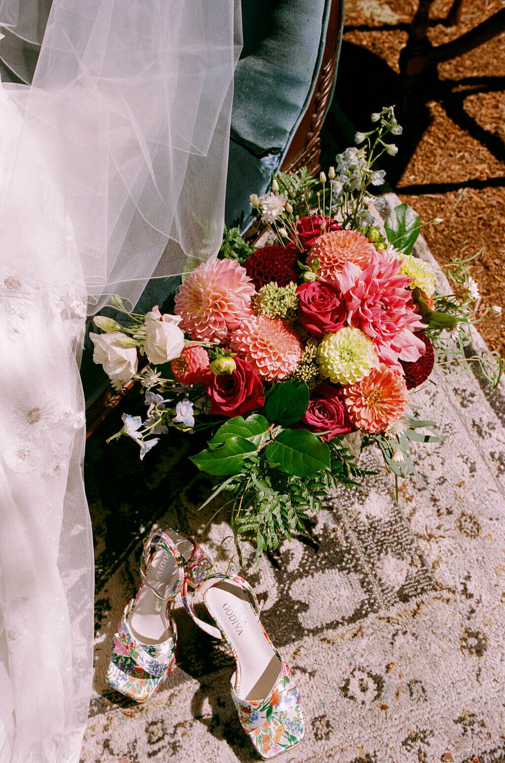 A flower arrangement at an outdoor garden wedding planned by Birdie June Events.