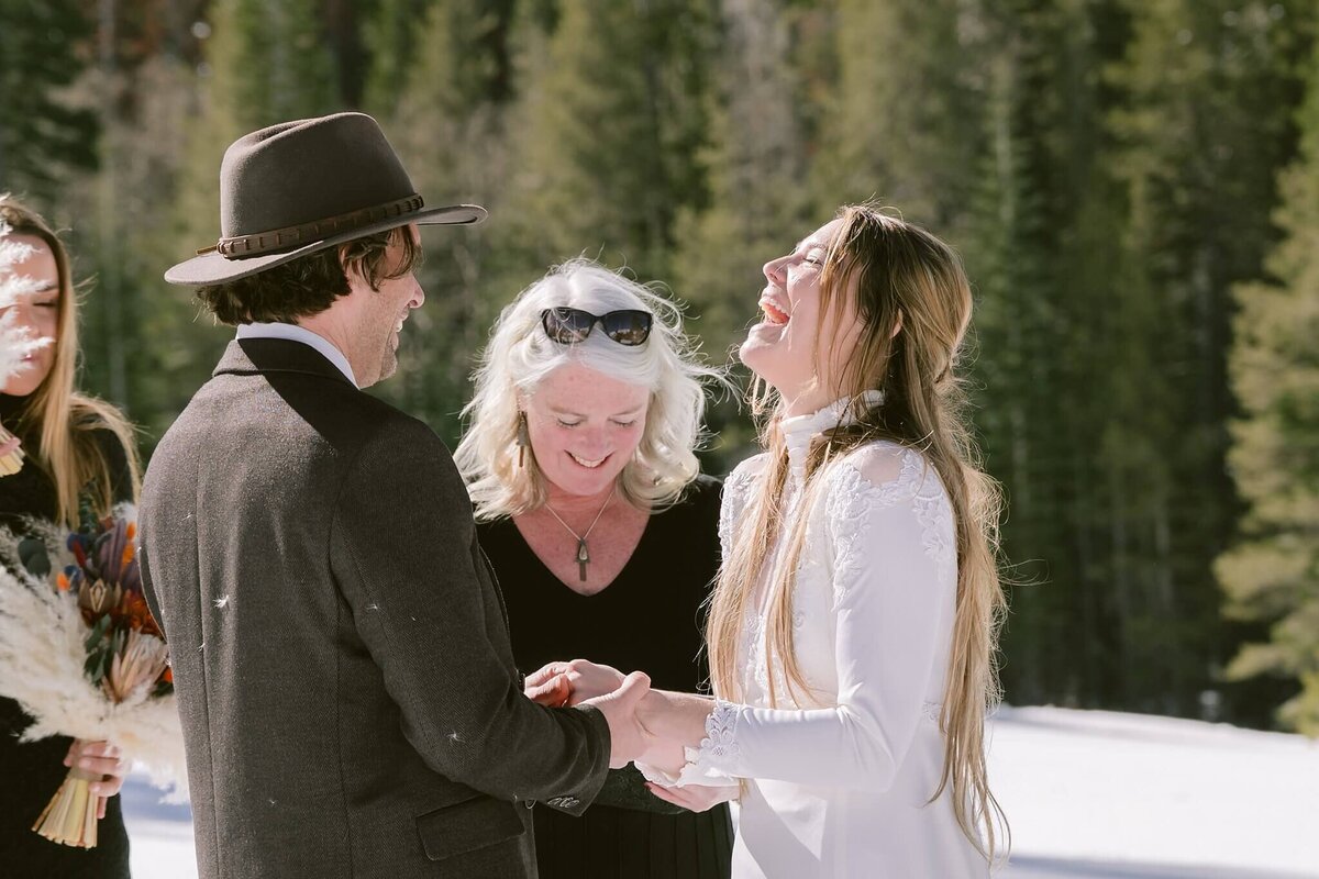 bride laughing during winter elopement in Palisades Tahoe