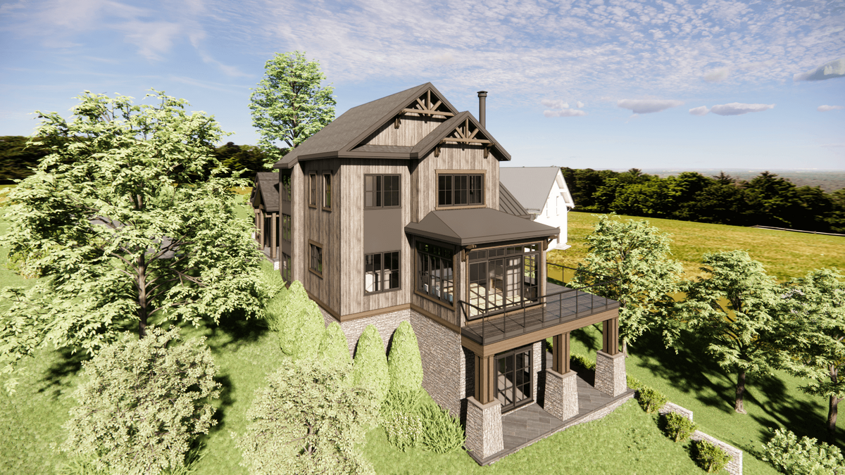 A modern, two-story wooden house with large windows and gabled roofs, surrounded by lush greenery and trees. A wraparound porch extends from the main structure, set against a clear blue sky with scattered clouds.