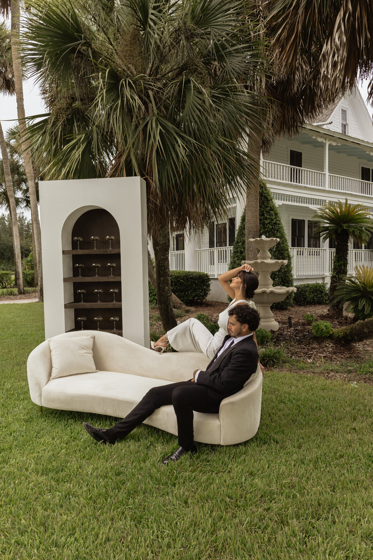 Champagne shelf display with gold accents at a luxury backyard wedding in Umatilla, Florida