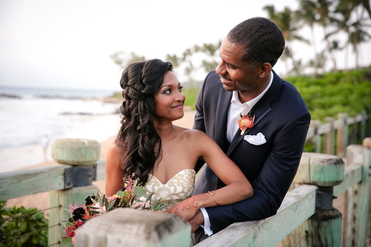 Maui Wedding Photography at The Andaz Maui Wailea of the bride and groom on the bridge