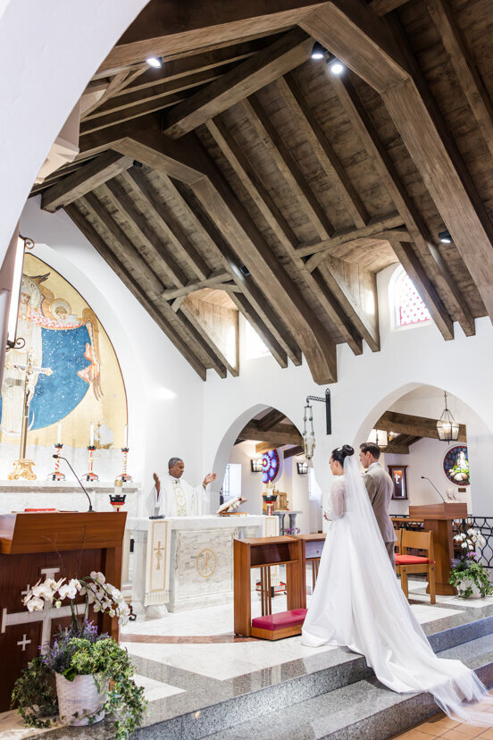 bride-and-groom-at-alter-mary-star-of-the-sea-catholic-church-wedding