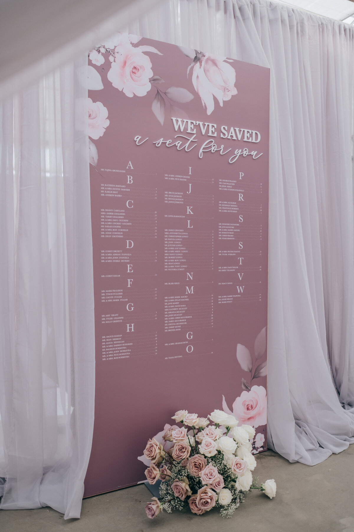 Luxurious floral themed lavender wedding seating chart for glamorous indoor wedding