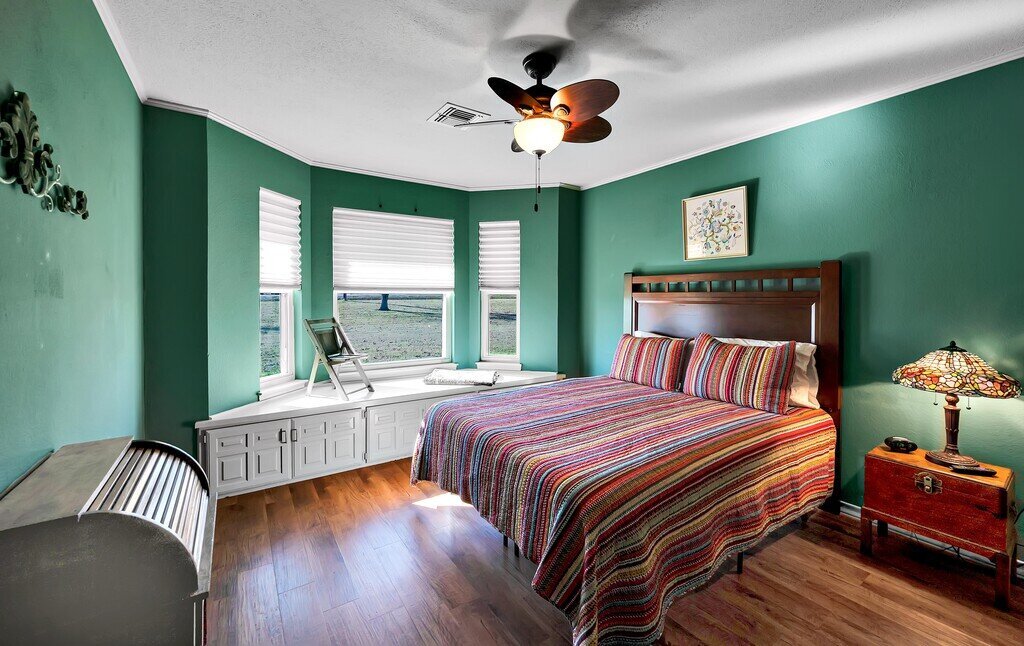 Spacious bedroom with beautiful view in this three-bedroom, two-bathroom vacation rental home with hot tub, firepit, and free WiFi just minutes from Lake Waco.