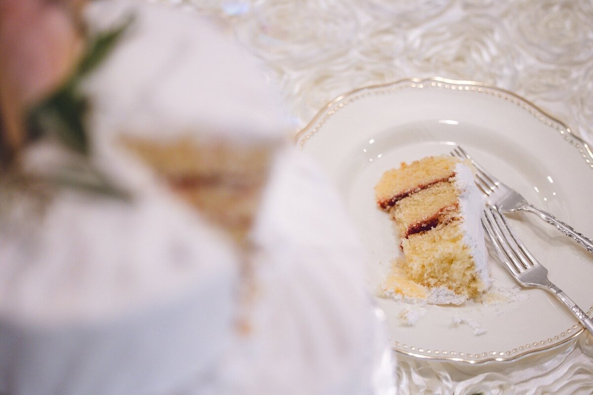 Close-up of wedding cake slice at reception